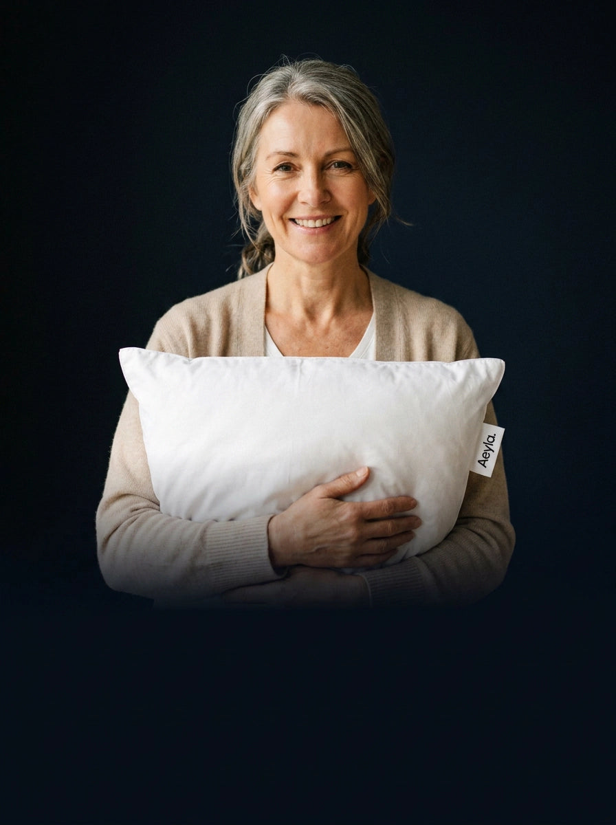[REPLACE: Aeyla Dual Pillow styled on a hotel-quality bed, warm morning light]